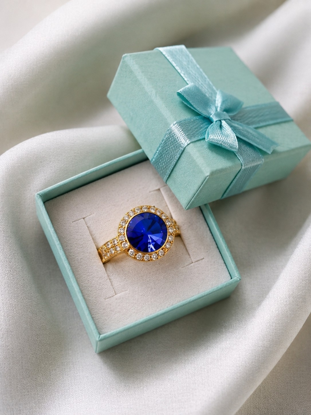 Gold Plated Ring with Blue Center Stone and Crystal Halo